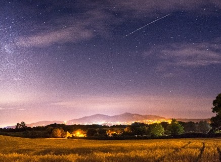 Malvern Spa Association card C showing the malverns from a distance under an evening sky