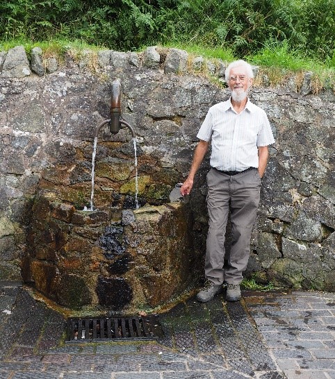 Dr. John Payne next to Hayslad Well. (Photo: John Gunn)