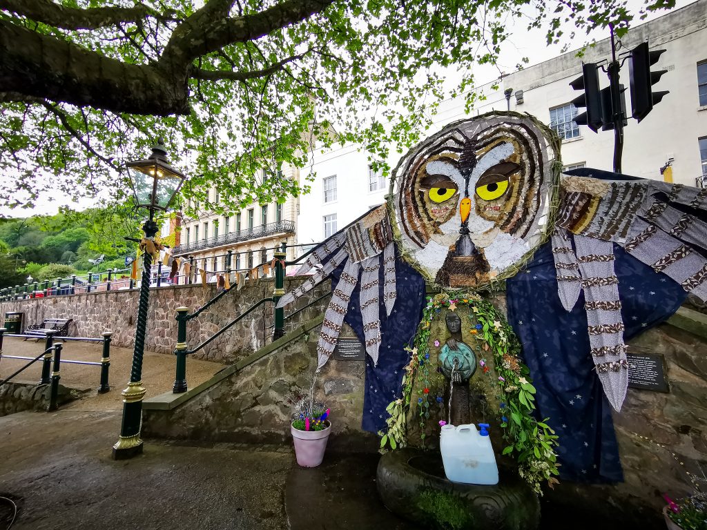 Malvhina well, on Belle Vue Island Great Malvern, decorated with a large owl